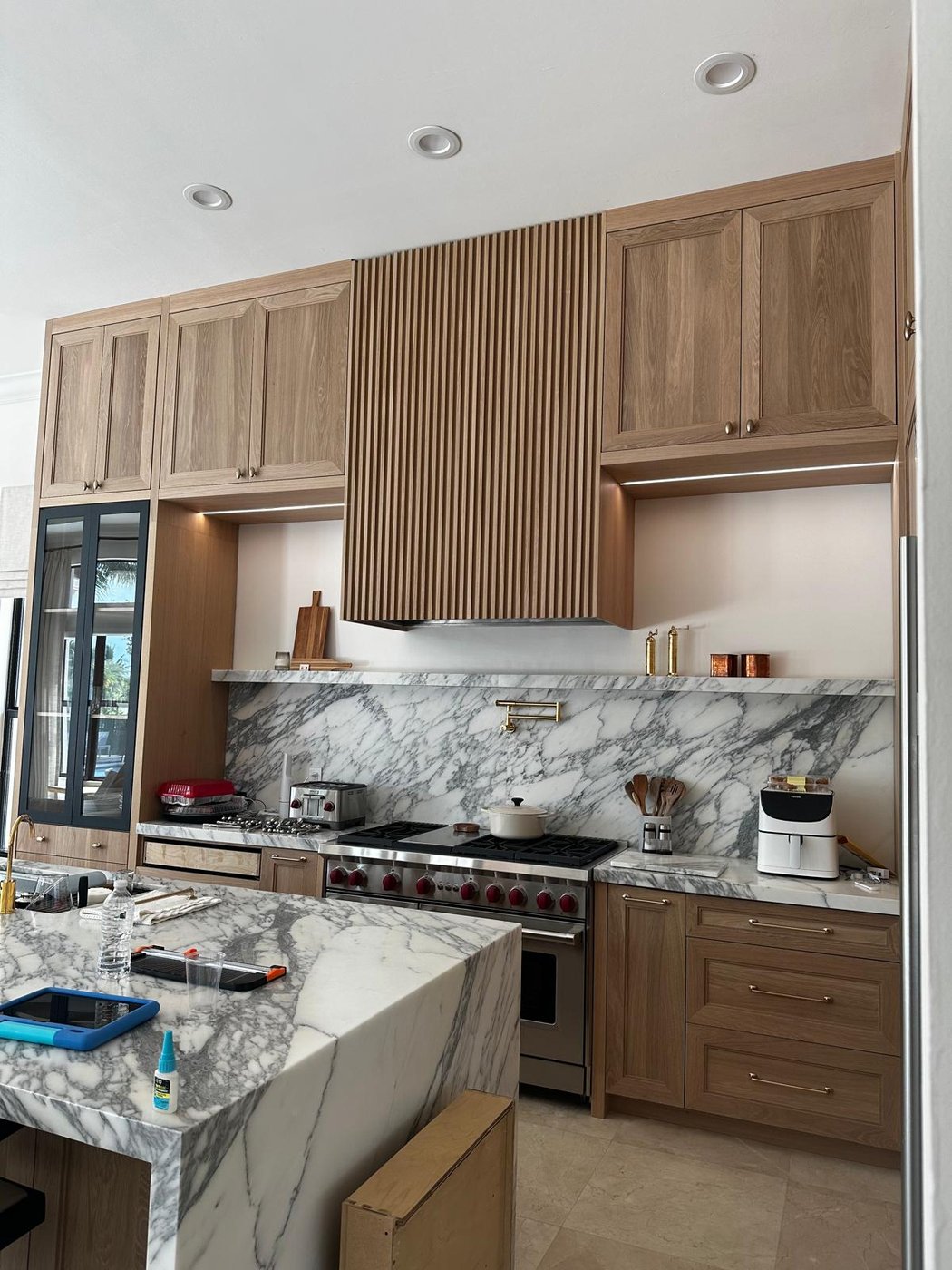 Custom range hood and cabinetry